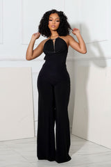 Wide leg halter jumpsuit with deep plunging cowl neck featuring a metal choker detail