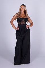 Strapless sheer lace corset jumpsuit with sweetheart bustier bodice 
High waisted wide leg featuring fitted waistband with drawstring tie at the center front