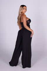 Strapless sheer lace corset jumpsuit with sweetheart bustier bodice 
High waisted wide leg featuring fitted waistband with drawstring tie at the center front