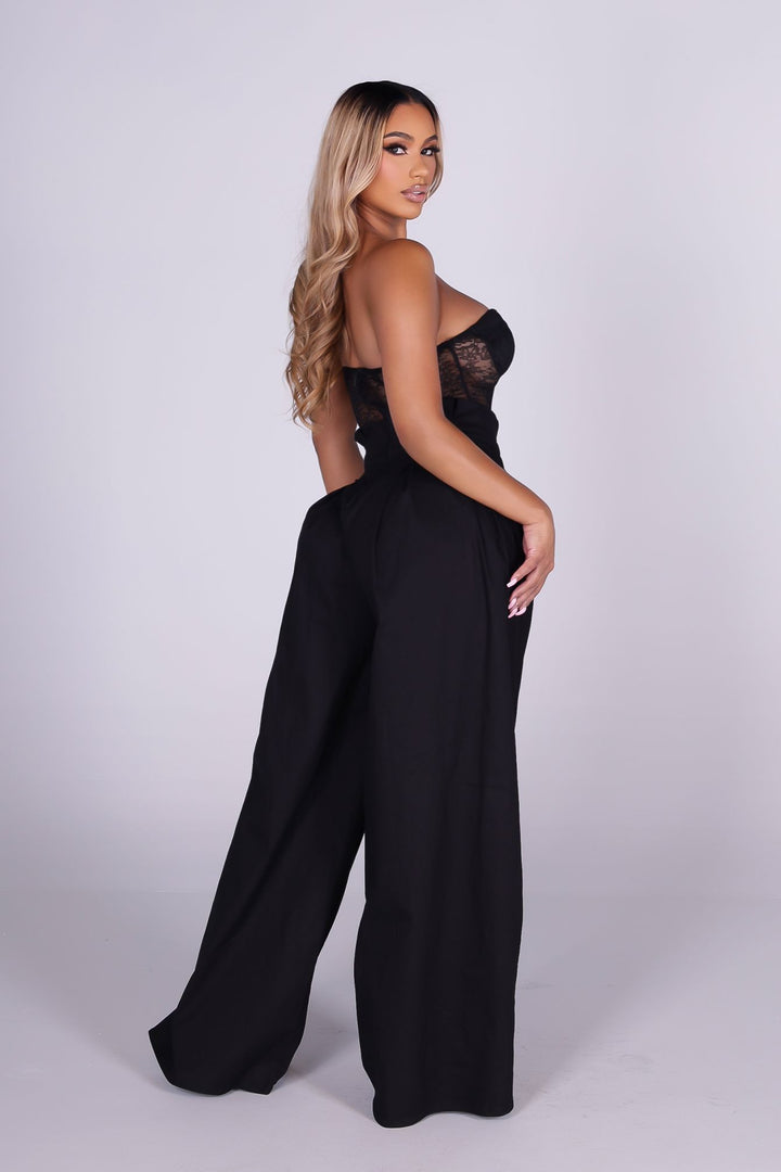 Strapless sheer lace corset jumpsuit with sweetheart bustier bodice 
High waisted wide leg featuring fitted waistband with drawstring tie at the center front