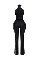 Halter neck jumpsuit with metallic gold ring accent at the throat featuring full length floral lace insert along the side seam