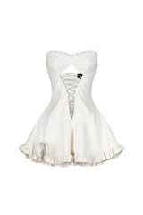 Faux leather corset tube mini dress with sweetheart neckline featuring center cutout with lace up and ruffle hem