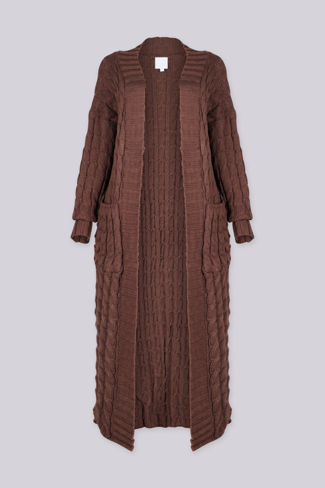 Long sleeve chunky cable knit cardigan in a floor grazing duster length with open front featuring ribbed cuffs and trim