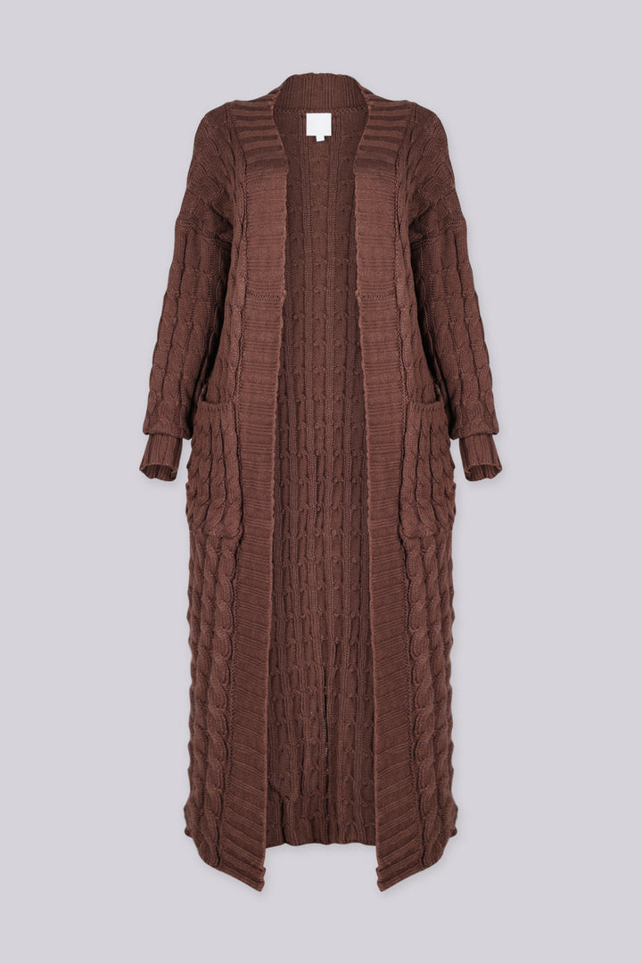 Long sleeve chunky cable knit cardigan in a floor grazing duster length with open front featuring ribbed cuffs and trim