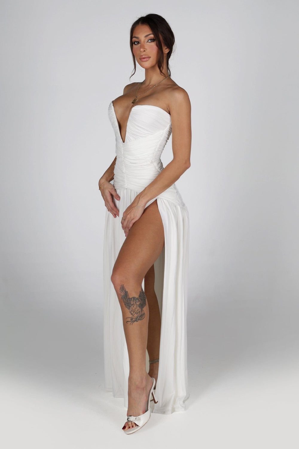 Dropped waist strapless maxi dress with a heavily ruched bodice for a sculpted fit
