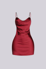 Mini dress with a cowl neckline featuring rhinestone trim and adjustable spaghetti straps