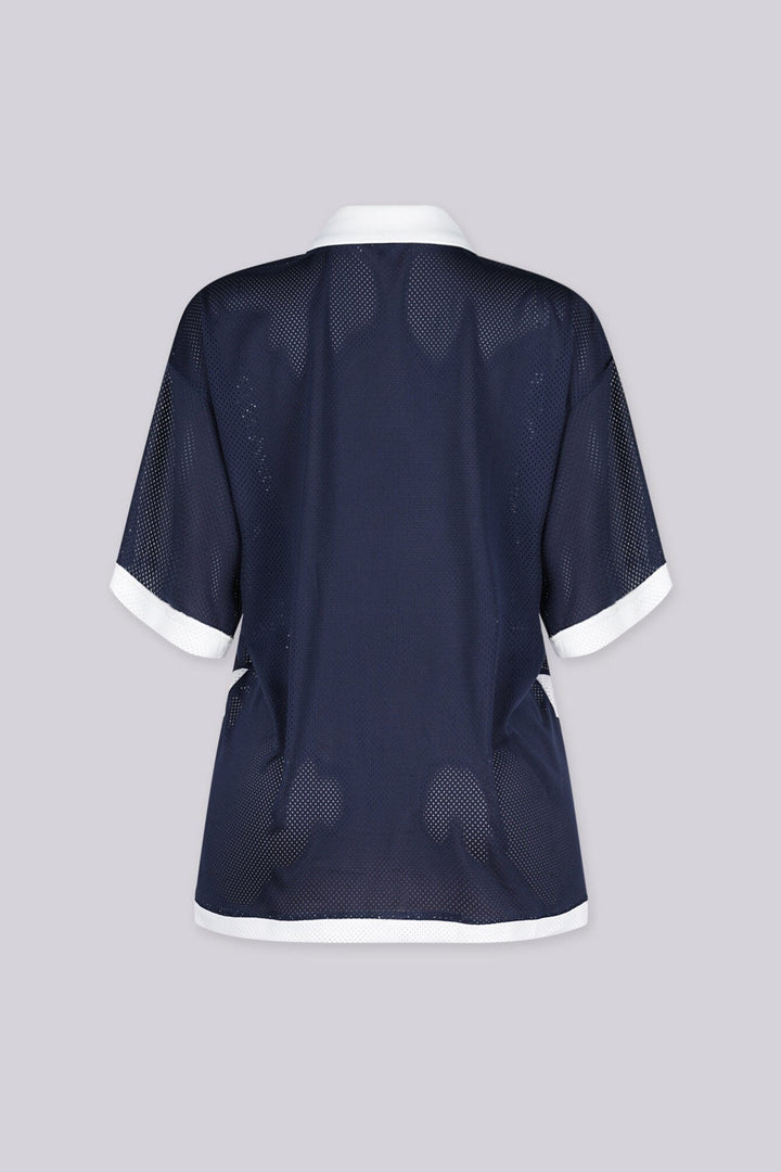 Oversized mesh jersey featuring v neck paired with a classic white fold-over polo collar