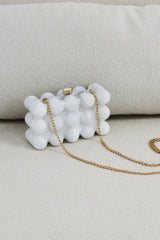 EDGE — pearl bubble-textured mini clutch, front view flat lay