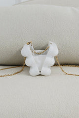 EDGE — pearl bubble-textured mini clutch shown open from the back, flat lay