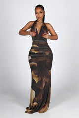 Mesh halter maxi dress with a plunging draped neckline featuring allover rhinestone embellishments