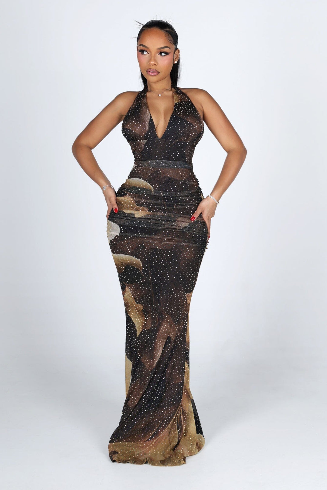 Mesh halter maxi dress with a plunging draped neckline featuring allover rhinestone embellishments