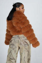 Cropped faux fur jacket with oversized collar and horizontal panel detail throughout