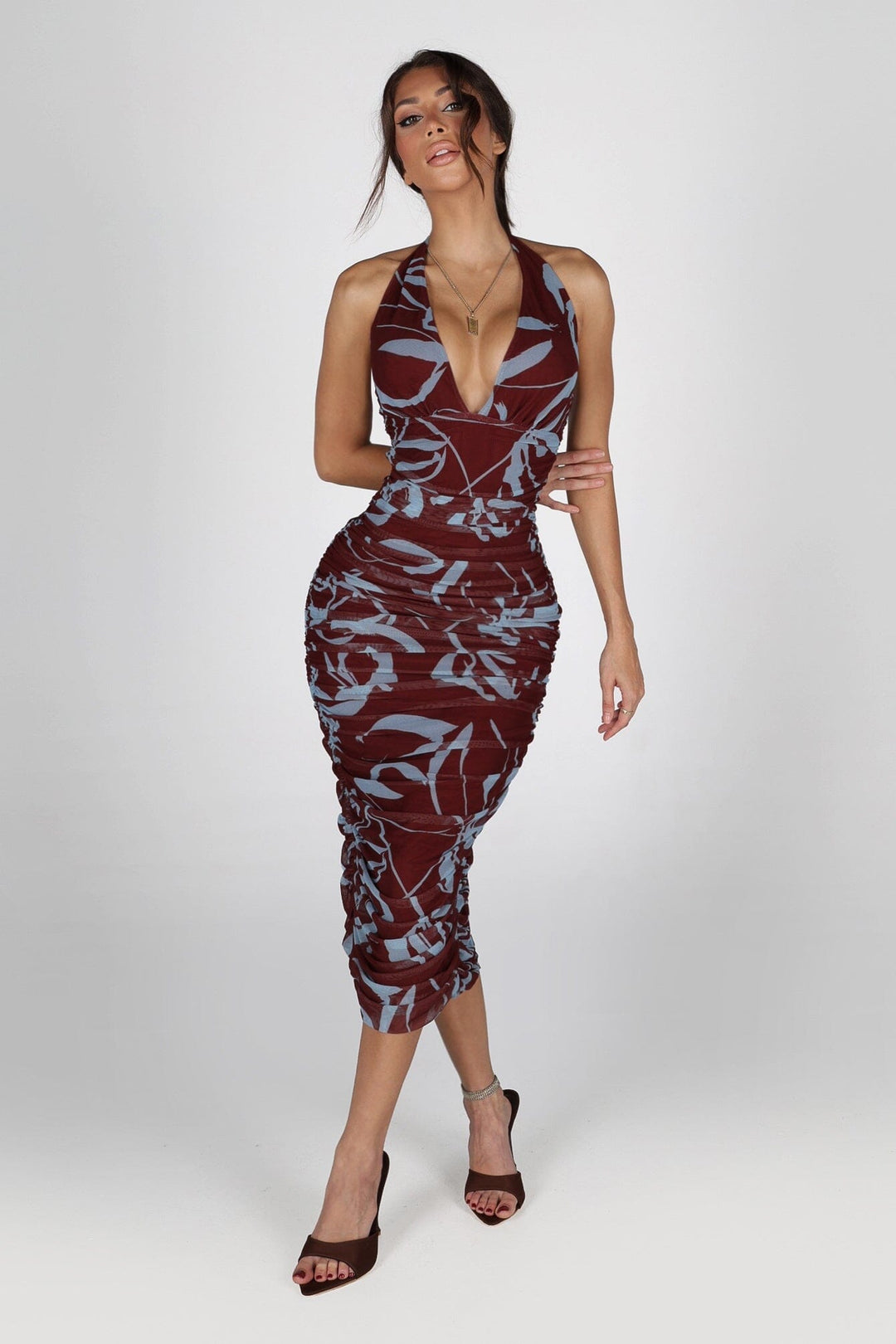 Bodycone silhouette mesh halter neckline dress with a deep plunging V front