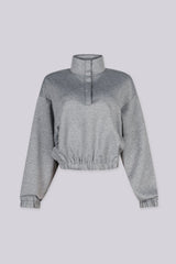 Cropped pullover sweatshirt with mock neckline and balloon sleeves featuring elastic hem and cuffs