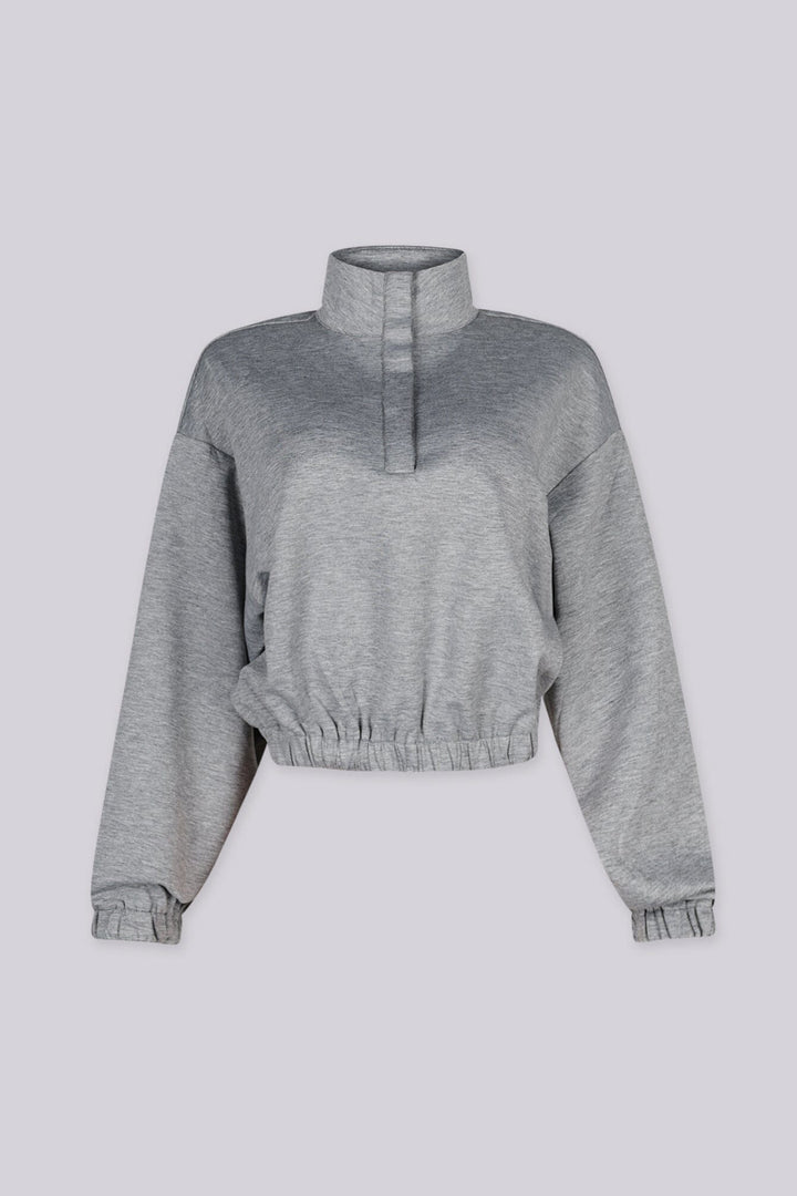 Cropped pullover sweatshirt with mock neckline and balloon sleeves featuring elastic hem and cuffs