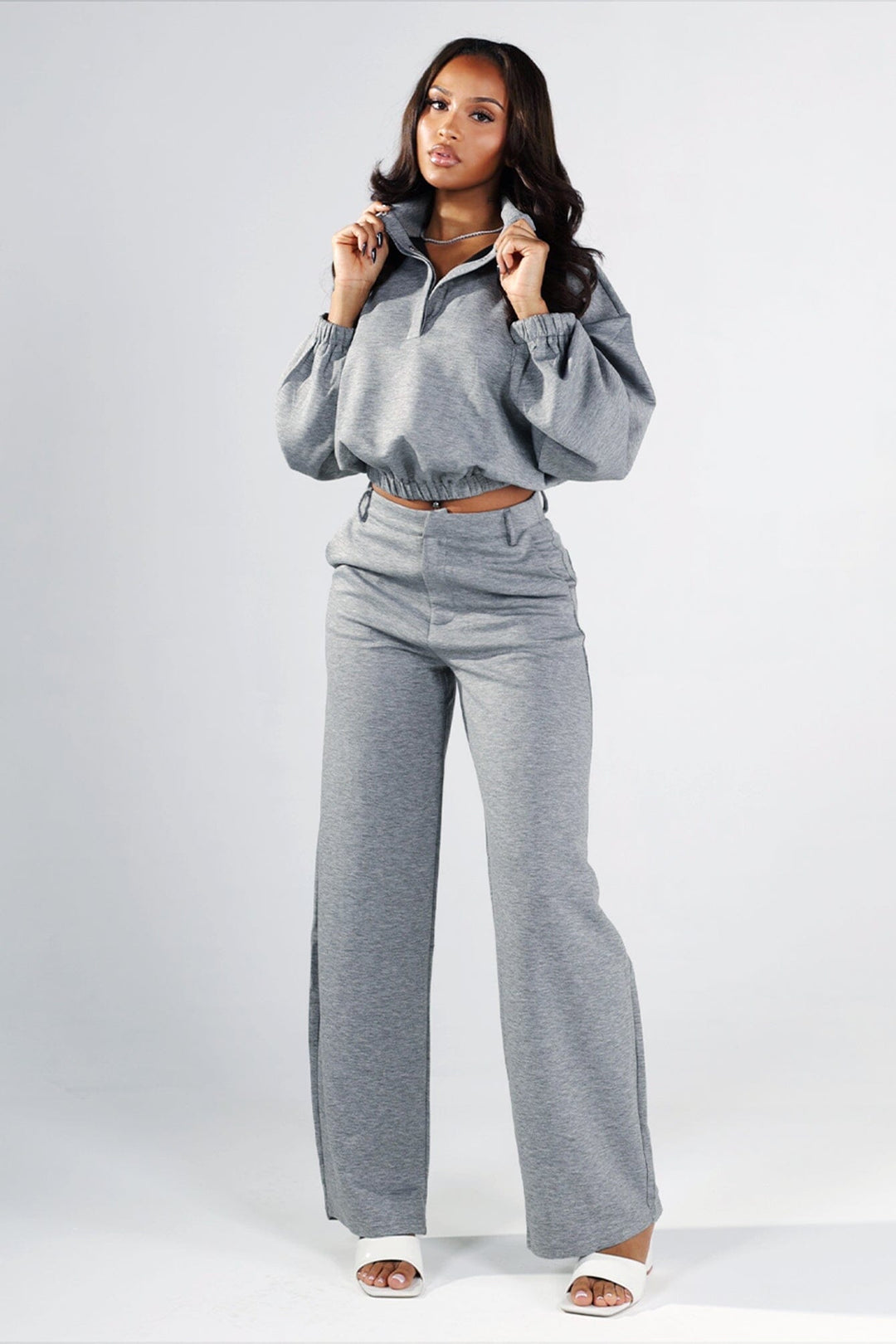 Cropped pullover sweatshirt with mock neckline and balloon sleeves featuring elastic hem and cuffs