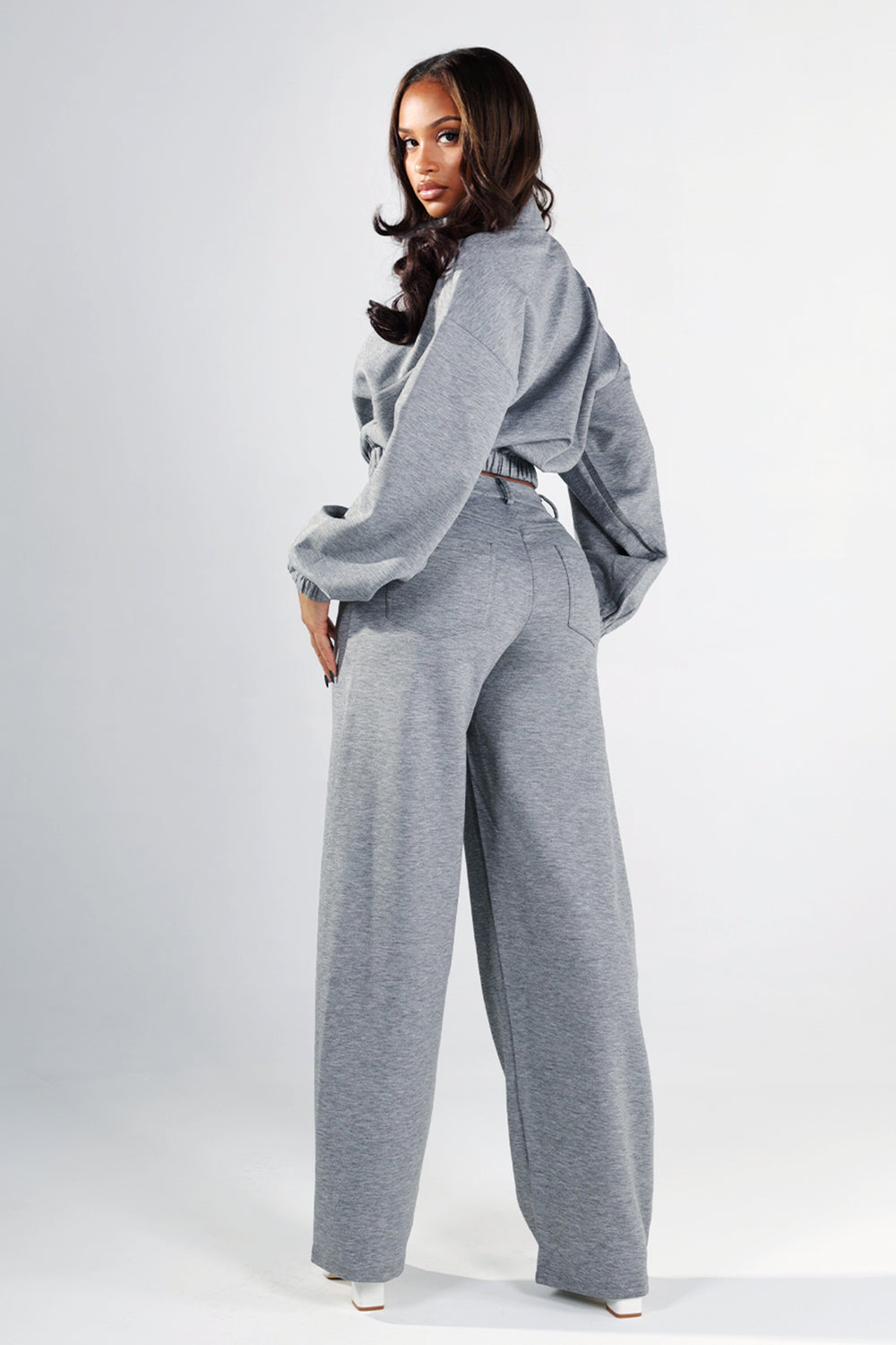 High rise wide leg pants with slight barrel silhouette and side pockets