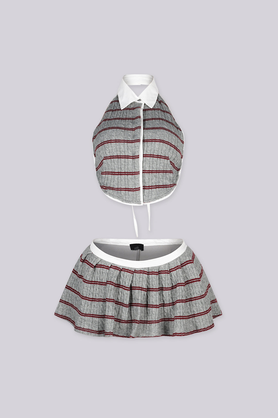 Cropped collared halter top with button front closure Matching low rise pleated mini skirt with contrast waistband