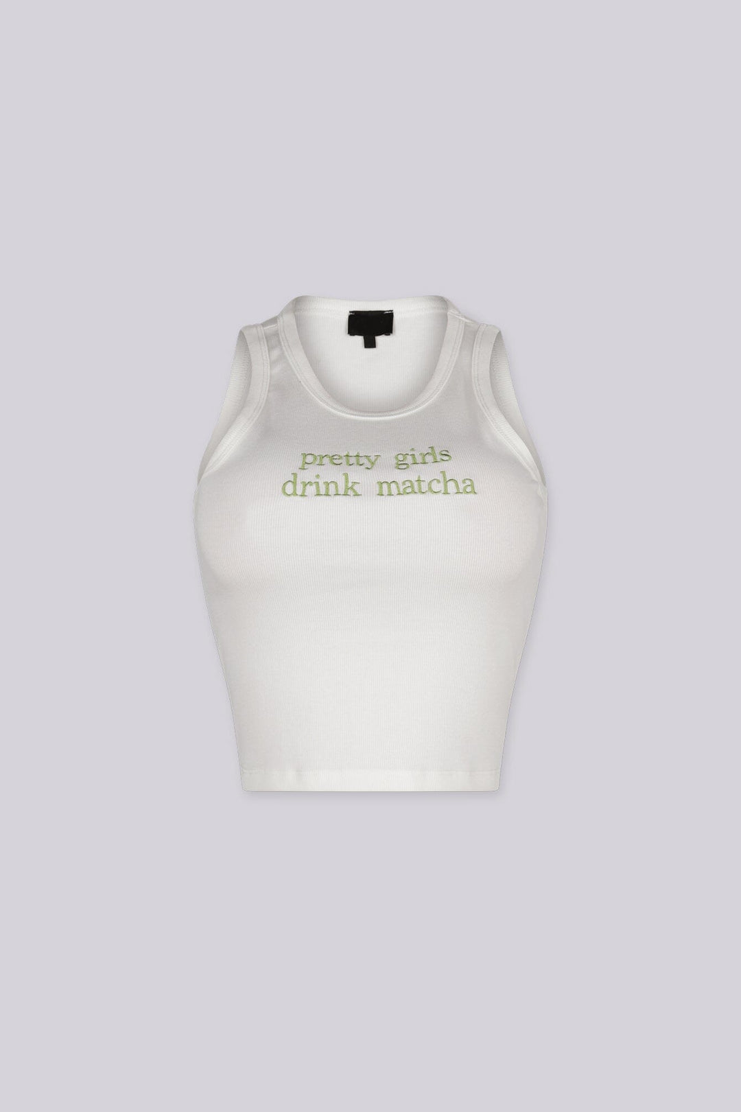 White ribbed tank top featuring "pretty girls drink matcha" embroidered graphic