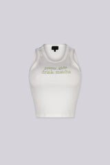 White ribbed tank top featuring "pretty girls drink matcha" embroidered graphic