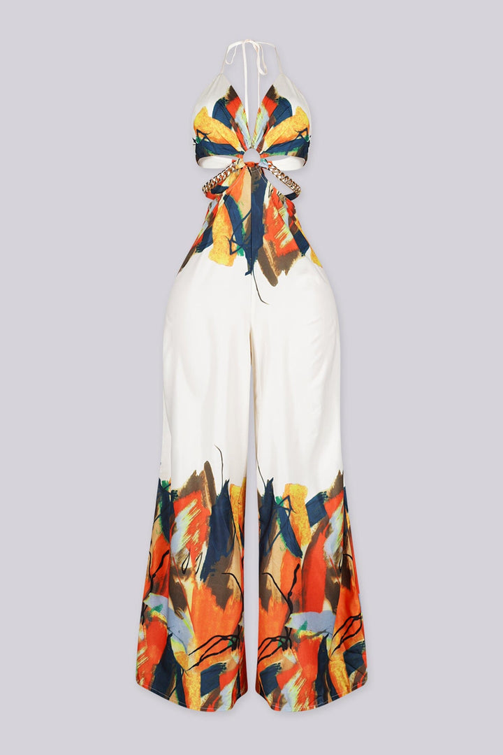 Halter neck jumpsuit featuring center O-ring with waist cut-outs, Edge gold chain straps connecting the front ring to the back ties