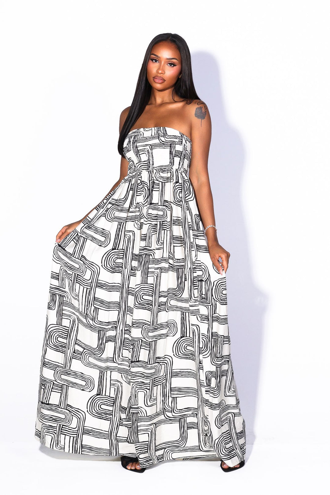 Retro geometric print tube top jumpsuit featuring a smocked bodice for secure and stretchy fit, High waisted wide leg fit