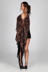 Sheer mesh poncho top with a wide boat neckline featuring asymmetrical 
