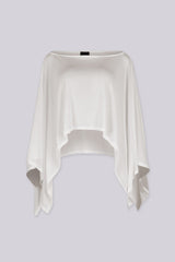 Sheer mesh poncho top with a wide boat neckline featuring asymmetrical 