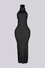 Sleeveless ribbed knit urtleneck maxi dress with halter neckline featuring body skimming stretch fit