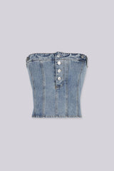 Strapless corset silhouette denim tube top designed to jeans waistband with decorative front buttons, Vertical seam paneling that structures the bodice