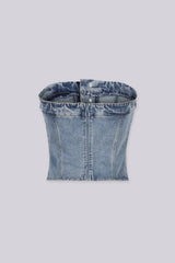 Strapless corset silhouette denim tube top designed to jeans waistband with decorative front buttons, Vertical seam paneling that structures the bodice