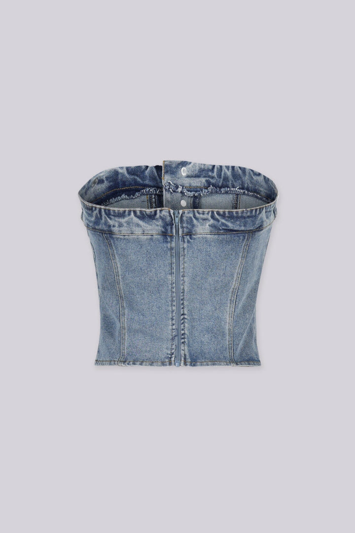 Strapless corset silhouette denim tube top designed to jeans waistband with decorative front buttons, Vertical seam paneling that structures the bodice