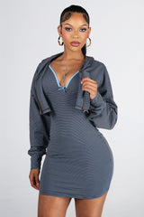 Stripped fitted mini tank dress with adjustable spaghetti straps and bow detail