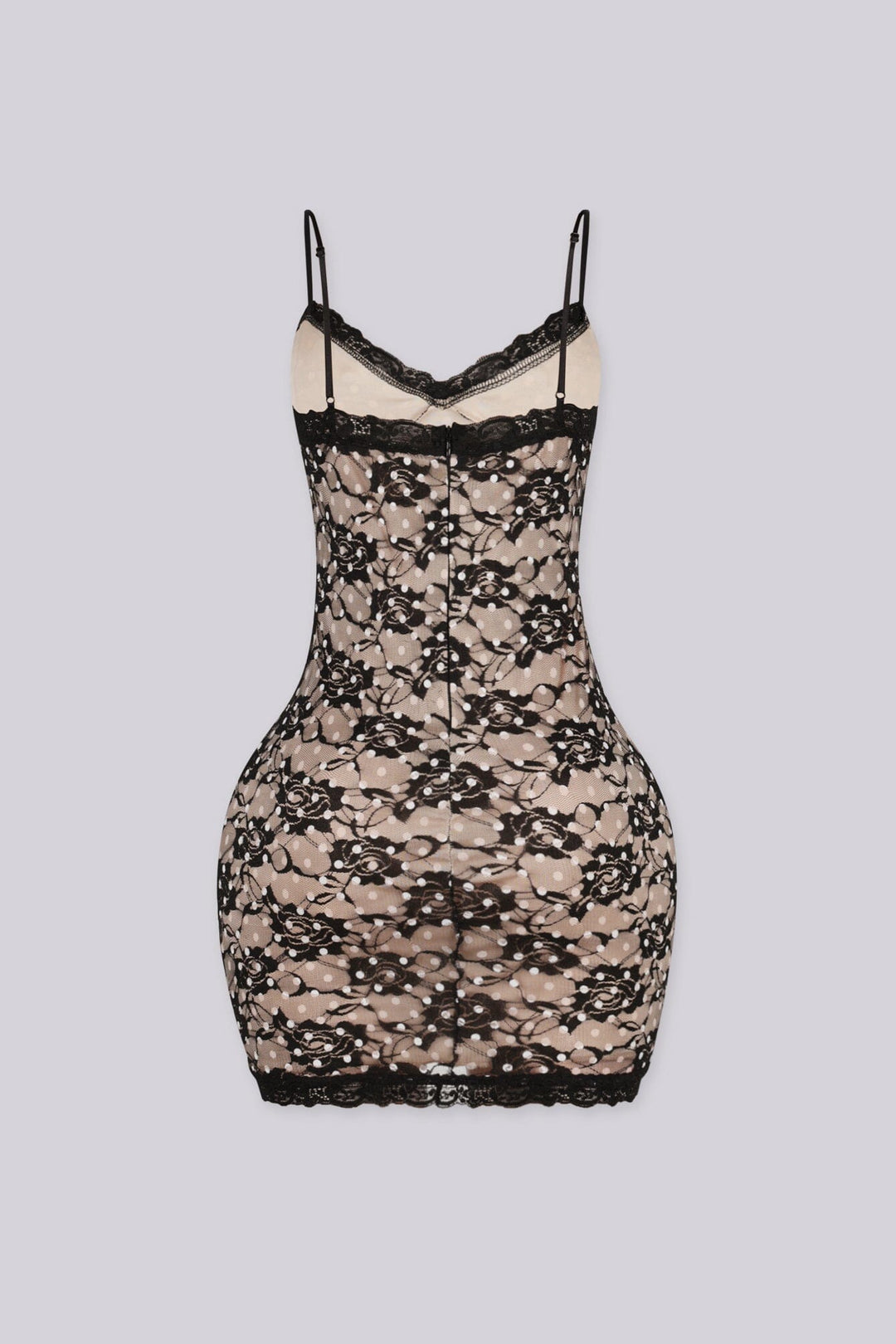 Bodycon mini dress featuring nude lining overlayed with black floral lace and white polka dot detailing