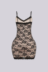 Bodycon mini dress featuring nude lining overlayed with black floral lace and white polka dot detailing