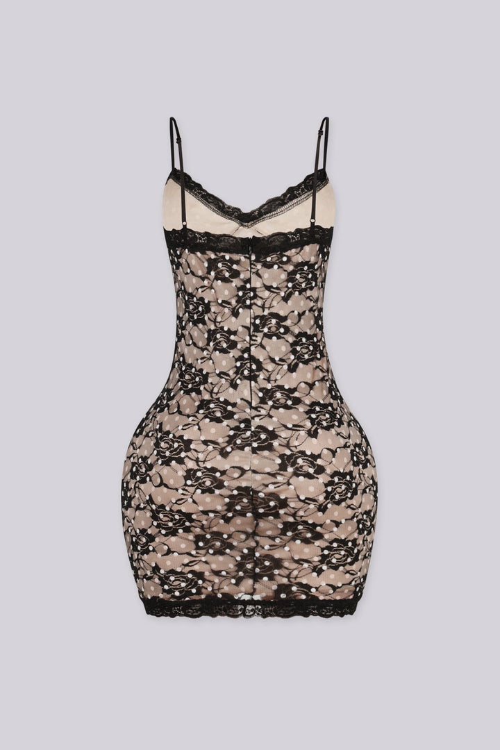 Bodycon mini dress featuring nude lining overlayed with black floral lace and white polka dot detailing