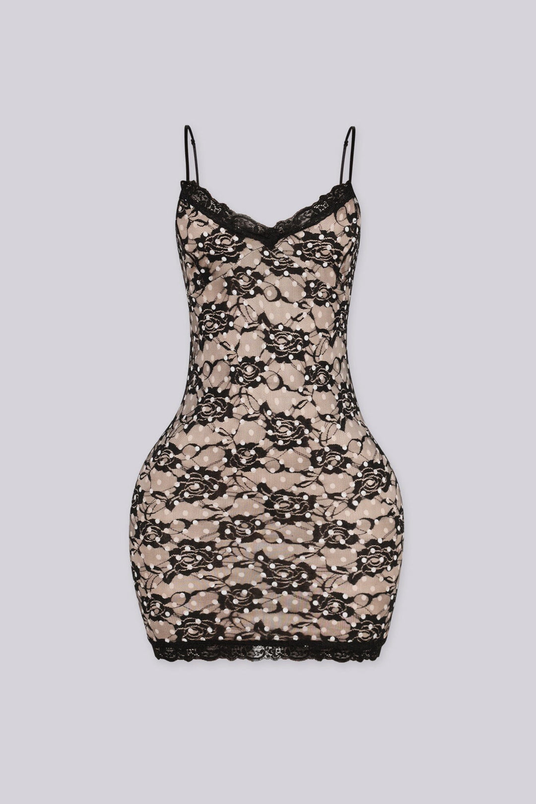 Bodycon mini dress featuring nude lining overlayed with black floral lace and white polka dot detailing