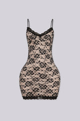 Bodycon mini dress featuring nude lining overlayed with black floral lace and white polka dot detailing
