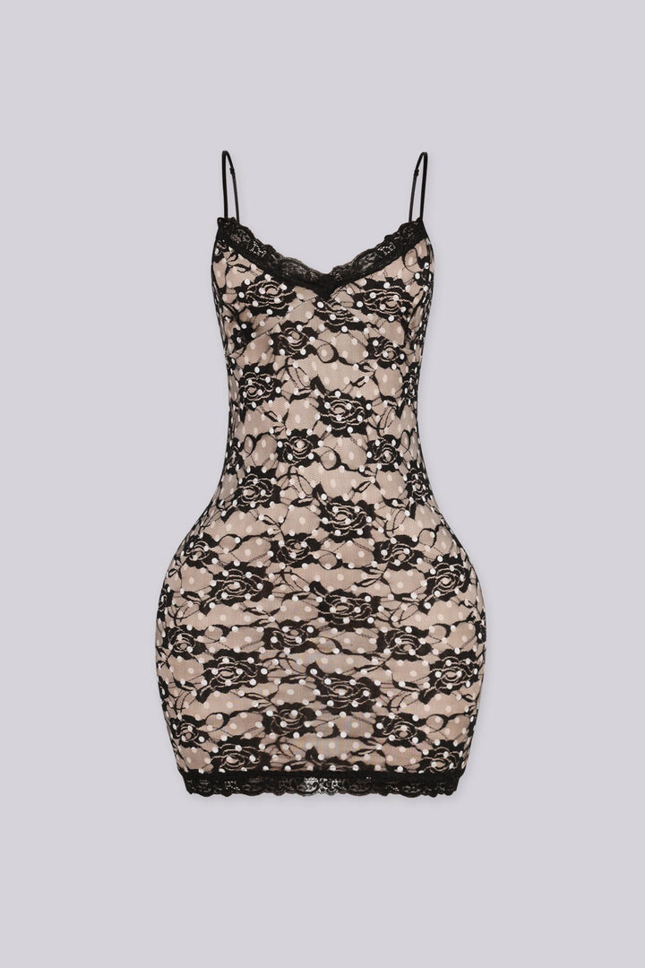 Bodycon mini dress featuring nude lining overlayed with black floral lace and white polka dot detailing