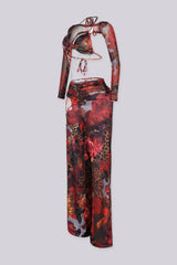 Mesh jumpsuit of vibrant floral and leopard prints featuring body-sculpting ruched bodice with detachable sheer bolero