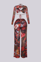 Mesh jumpsuit of vibrant floral and leopard prints featuring body-sculpting ruched bodice with detachable sheer bolero