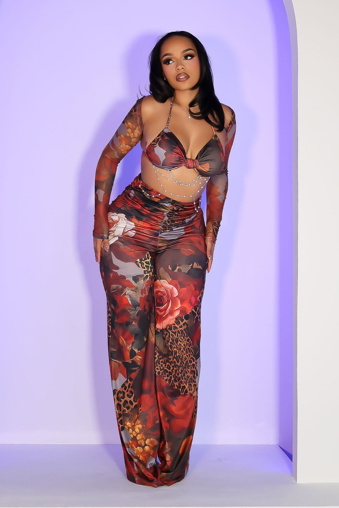 Mesh jumpsuit of vibrant floral and leopard prints featuring body-sculpting ruched bodice with detachable sheer bolero