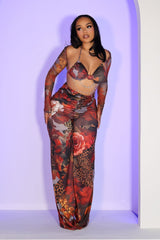 Mesh jumpsuit of vibrant floral and leopard prints featuring body-sculpting ruched bodice with detachable sheer bolero