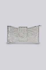 Bow shaped clutch bag with top zipper closure featuring all over rhinestone embellishment and buckle band detail