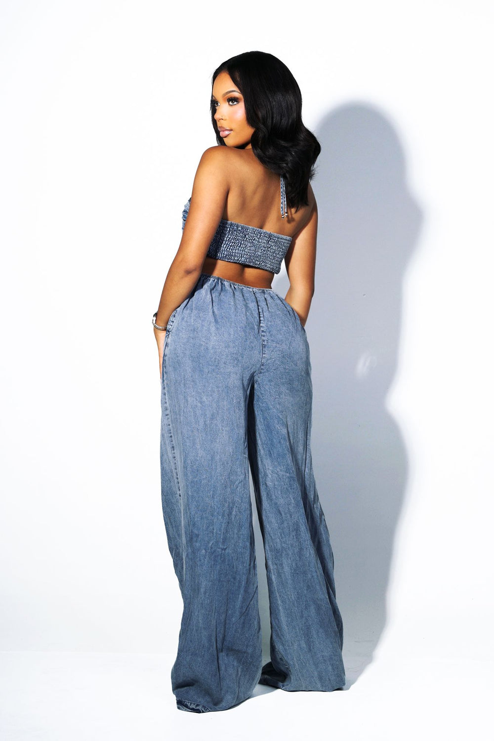 Wide leg floor-length jumpsuit with a tie neck halter top&nbsp;