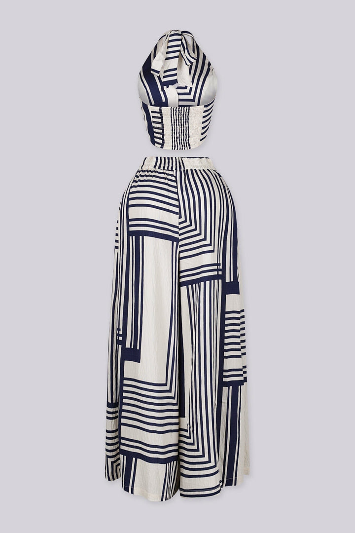 Halter neck cropped vest top with deep V front and open back tie neck detail
High waisted wide leg pants featuring deep front pleats with wide elastic waistband