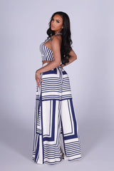 Halter neck cropped vest top with deep V front and open back tie neck detail
High waisted wide leg pants featuring deep front pleats with wide elastic waistband