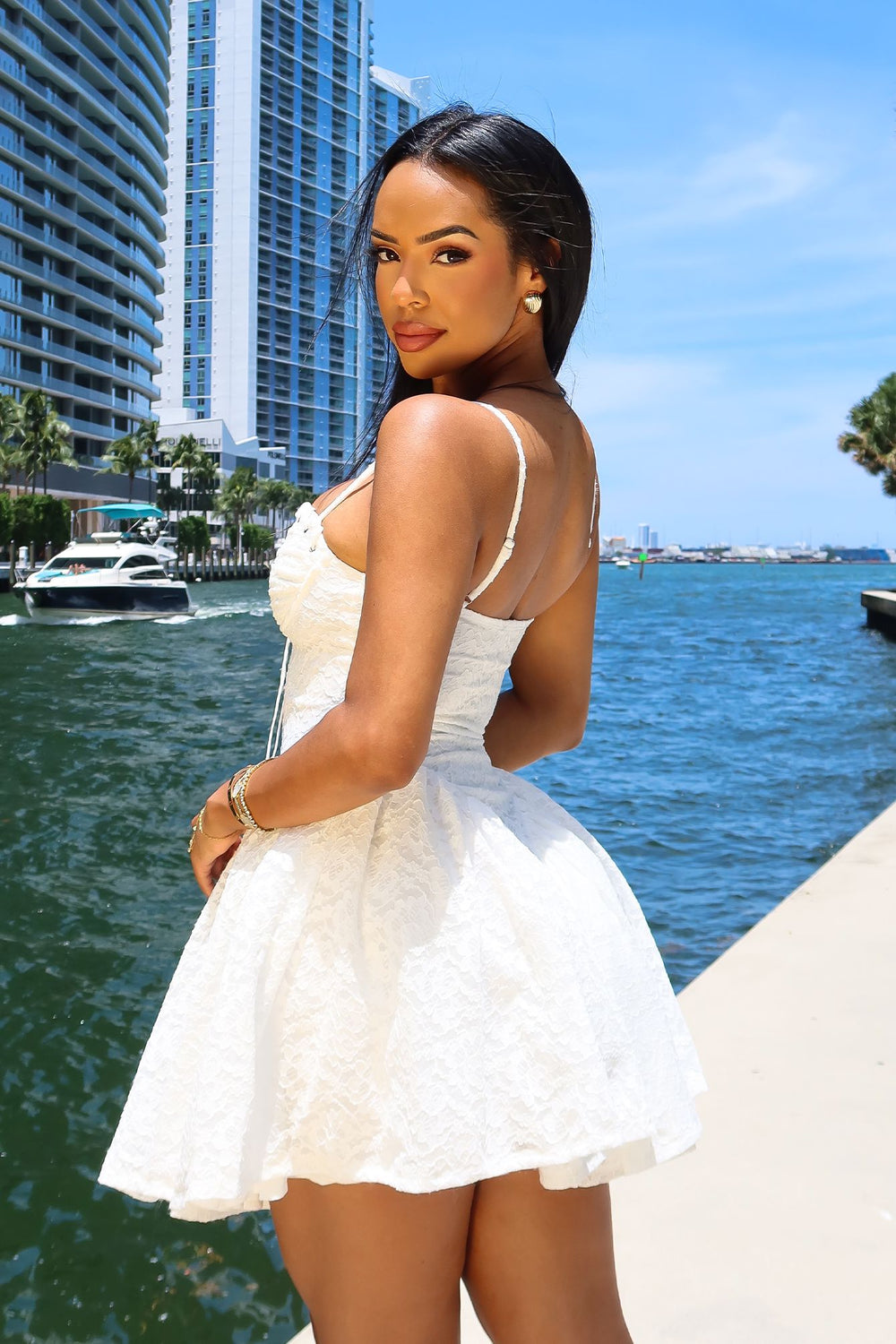 Lace mini dress featuring a corset bodice with silver eyelet lace-up front detail