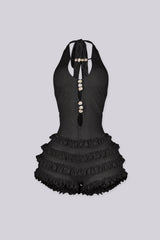 Fitted bodice halter romper with deep V neckline featuring vertical teardrop keyhole cutout and seashell beads embellishments
Micro mini shorts featuring overlaid with horizontal tiers of ruffle detailing