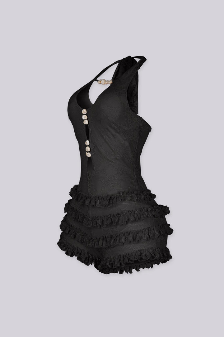 Fitted bodice halter romper with deep V neckline featuring vertical teardrop keyhole cutout and seashell beads embellishments
Micro mini shorts featuring overlaid with horizontal tiers of ruffle detailing